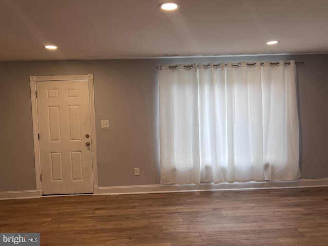 entryway with hardwood / wood-style floors