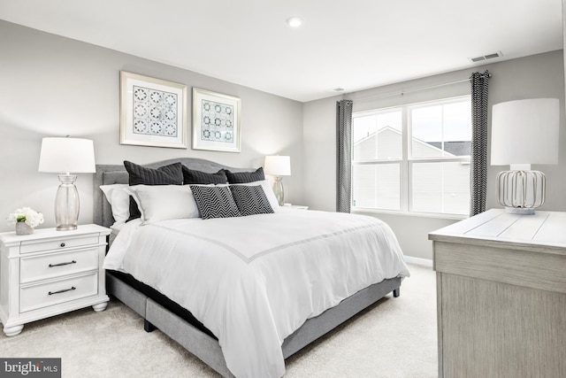 bedroom featuring light carpet