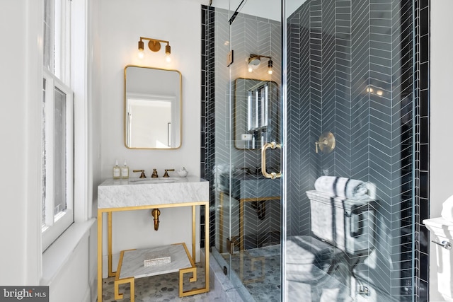 bathroom with vanity and a shower with shower door