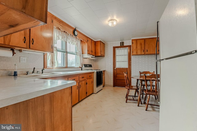 kitchen featuring sink and white appliances