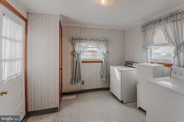 laundry room featuring washing machine and dryer and crown molding