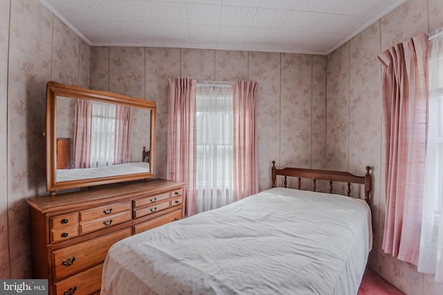 bedroom featuring multiple windows and crown molding