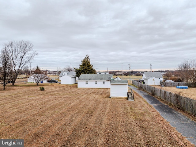 view of yard with a storage unit