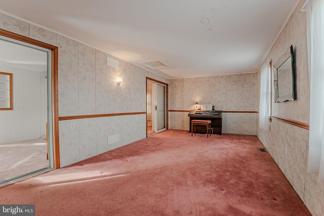 interior space with ornamental molding and light carpet