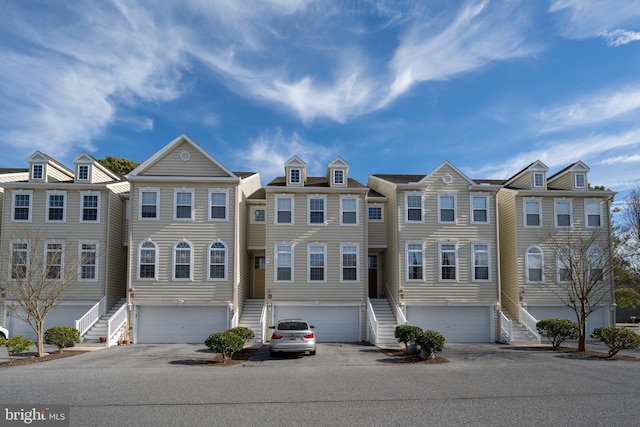 townhome / multi-family property featuring a garage