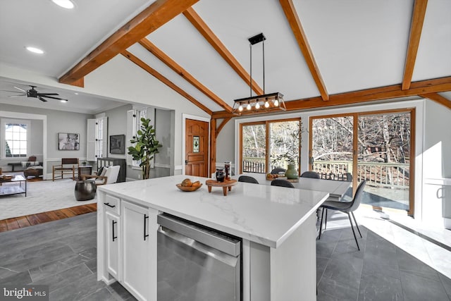 kitchen with dark wood-type flooring, a kitchen island, stainless steel dishwasher, pendant lighting, and white cabinets