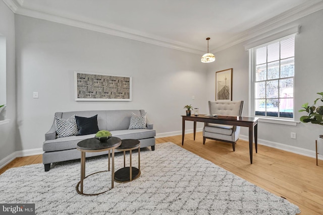 office space featuring light wood-type flooring and ornamental molding