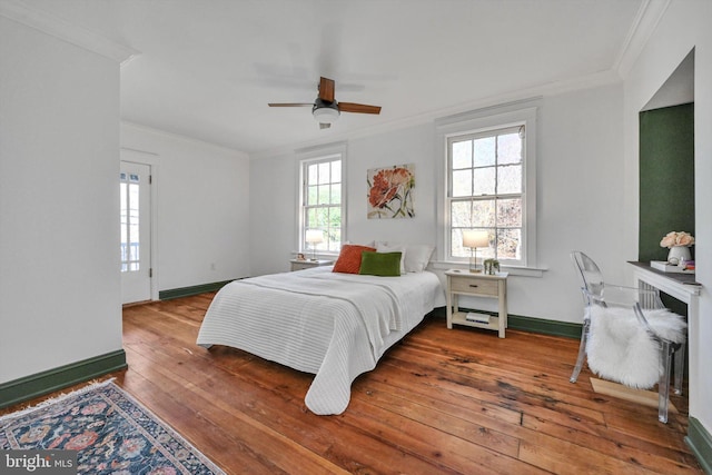 bedroom with wood-type flooring, ceiling fan, and crown molding