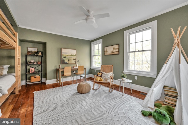 living area featuring dark hardwood / wood-style floors, ceiling fan, and ornamental molding