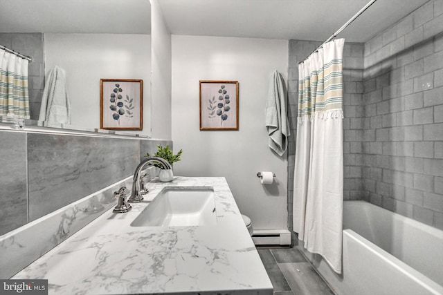 bathroom featuring baseboard heating, vanity, wood-type flooring, and shower / tub combo