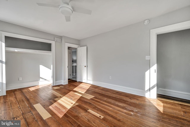 unfurnished bedroom featuring hardwood / wood-style floors and ceiling fan