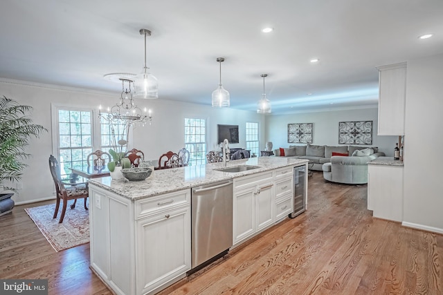 kitchen featuring white cabinets, wine cooler, decorative light fixtures, and stainless steel dishwasher