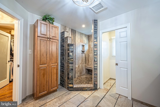 bathroom with a tile shower