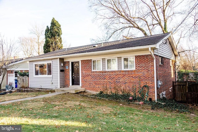 ranch-style home with a front lawn