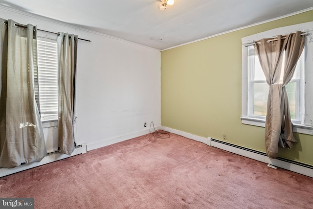 carpeted empty room featuring ornamental molding and baseboard heating