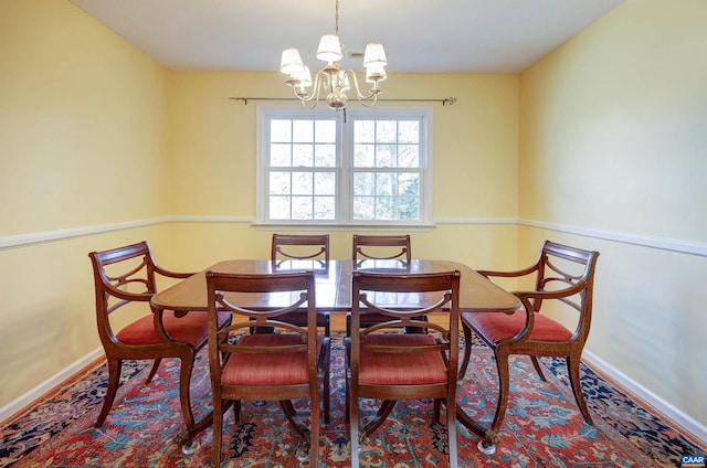 dining area featuring a chandelier