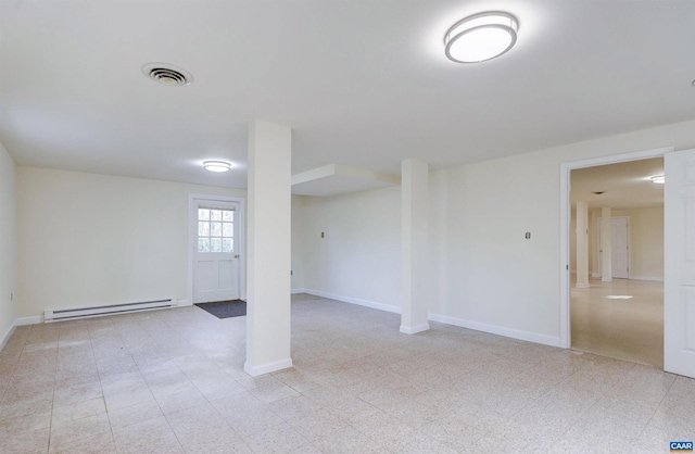 basement featuring a baseboard heating unit