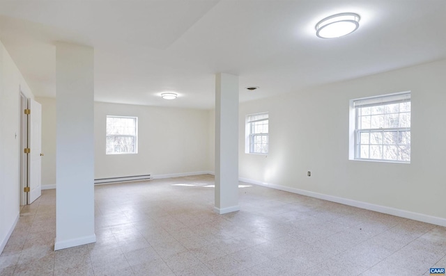 basement featuring a baseboard heating unit