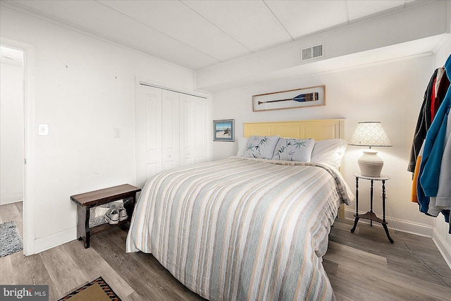 bedroom featuring hardwood / wood-style flooring and a closet