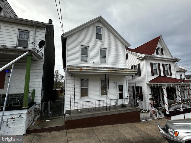 view of front property featuring covered porch