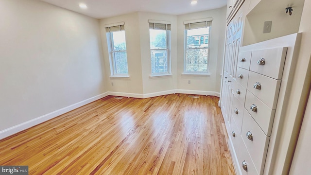 unfurnished room featuring light wood-type flooring