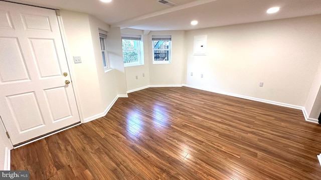 empty room featuring dark wood-type flooring