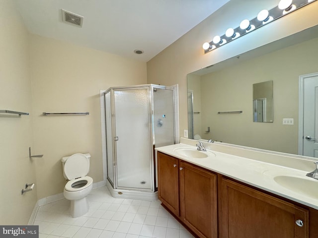 bathroom with toilet, vanity, tile patterned floors, and a shower with door