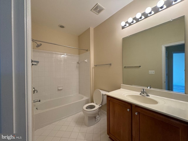 full bathroom with tile patterned floors, vanity, toilet, and tiled shower / bath combo