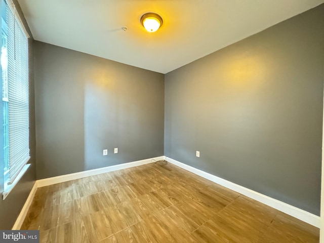 empty room featuring hardwood / wood-style flooring