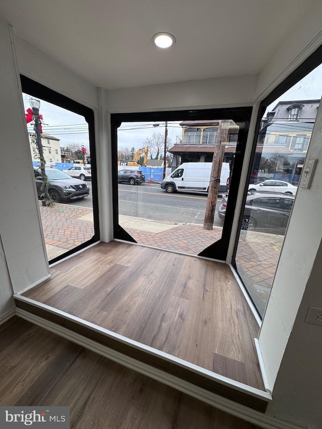 doorway to outside with hardwood / wood-style floors and a wealth of natural light