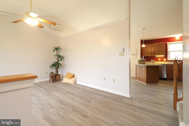 unfurnished living room featuring ceiling fan, a wall mounted AC, high vaulted ceiling, and light hardwood / wood-style flooring