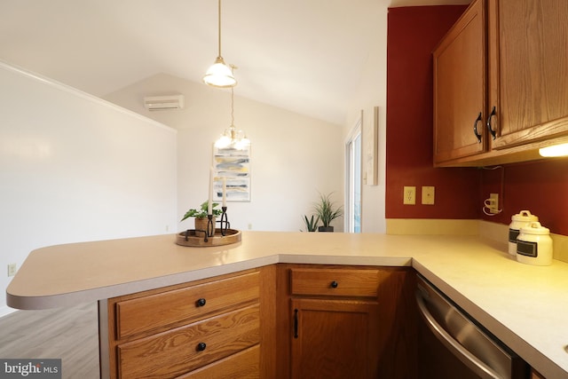 kitchen featuring stainless steel dishwasher, a wall unit AC, kitchen peninsula, pendant lighting, and lofted ceiling