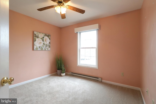 carpeted empty room with baseboard heating and ceiling fan