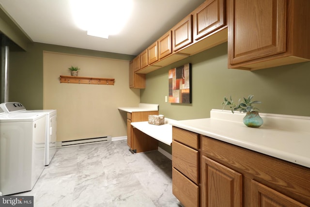 clothes washing area featuring cabinets, washer and clothes dryer, and a baseboard radiator