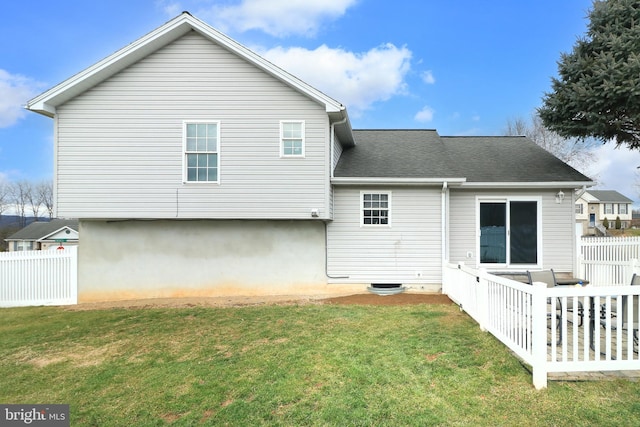 back of house with a yard