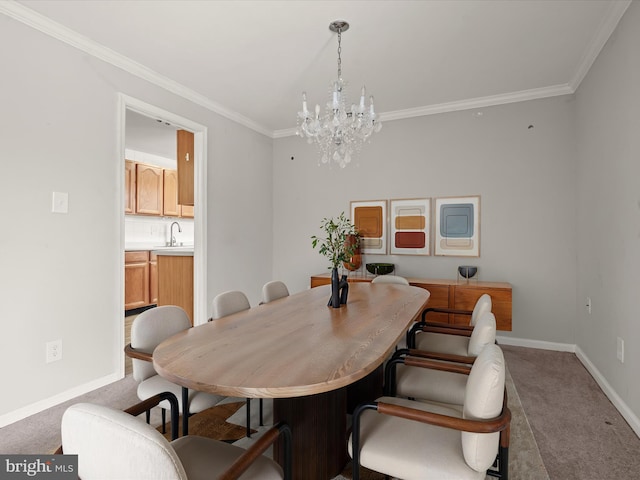 carpeted dining area with ornamental molding, sink, and an inviting chandelier