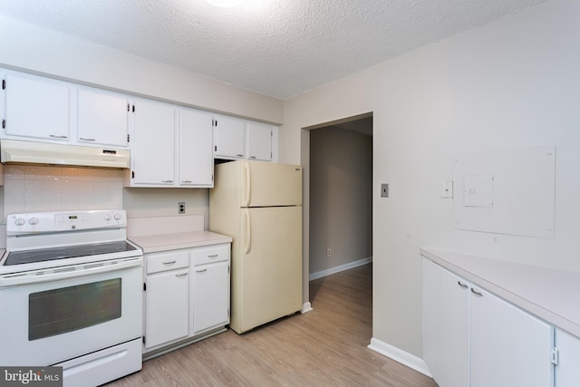 kitchen with white appliances, a textured ceiling, light hardwood / wood-style flooring, decorative backsplash, and white cabinetry