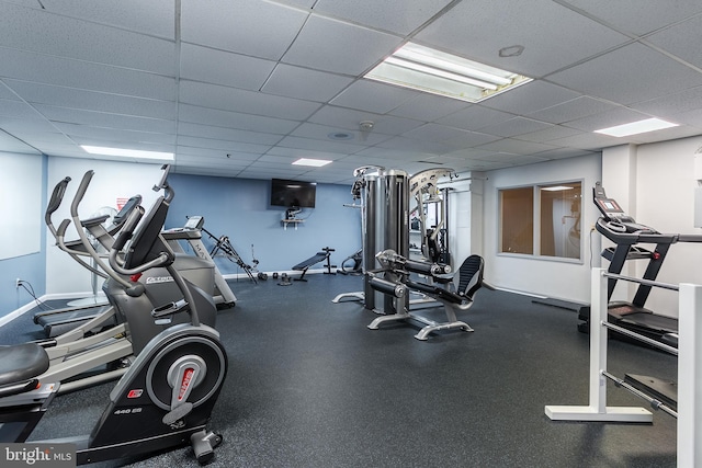 workout area with a paneled ceiling