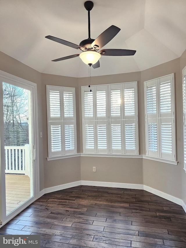 unfurnished sunroom featuring ceiling fan