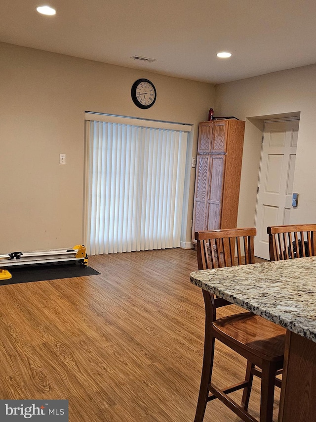 dining space featuring light wood-type flooring