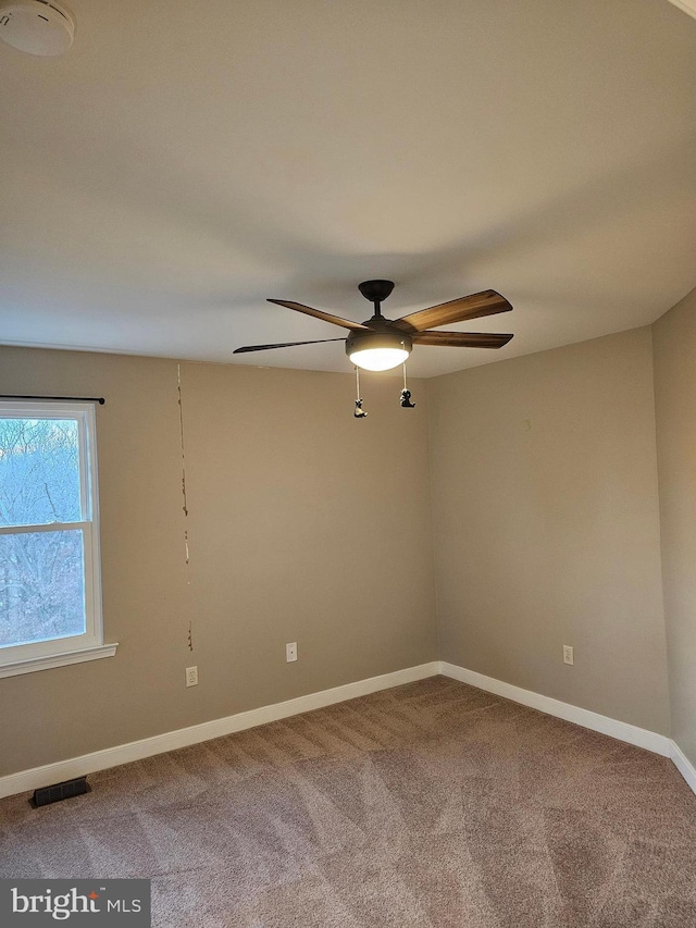 unfurnished room with carpet floors and ceiling fan