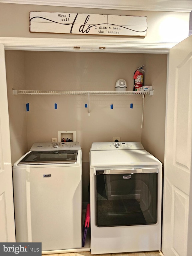 washroom featuring independent washer and dryer