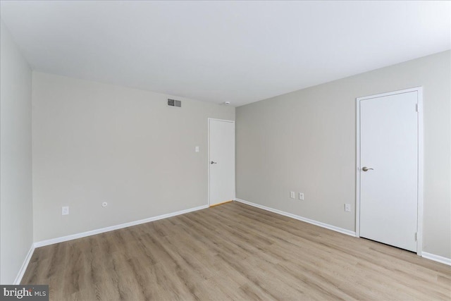 unfurnished room featuring light wood-type flooring