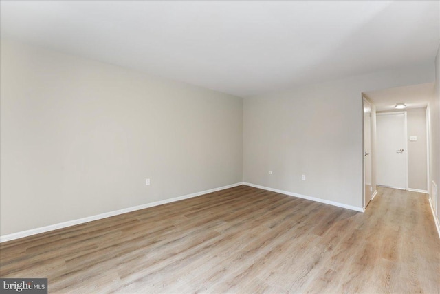 unfurnished room with light hardwood / wood-style floors