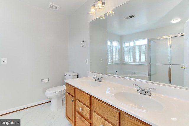 full bathroom with vanity, separate shower and tub, and toilet