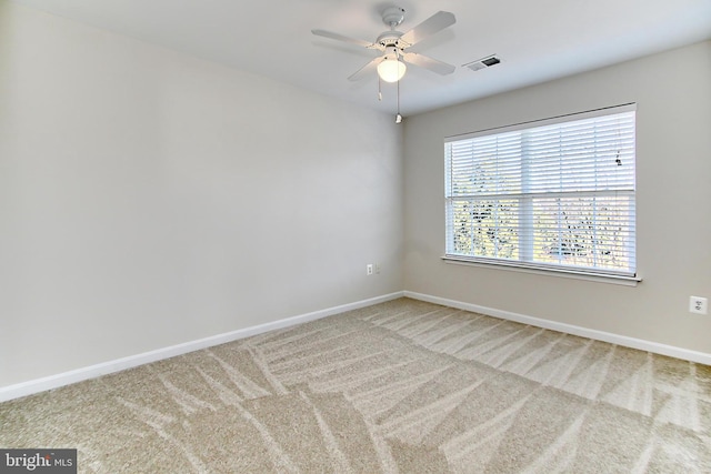 spare room with ceiling fan and carpet floors