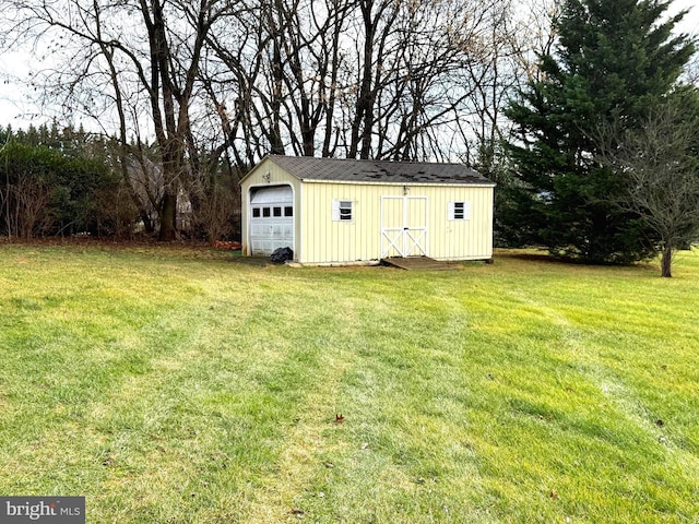 view of outbuilding with a lawn