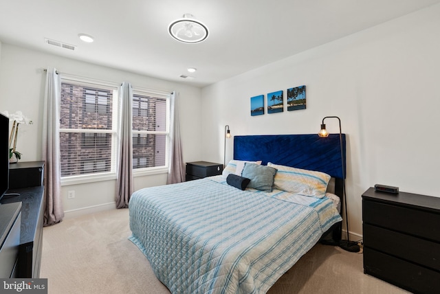 bedroom featuring light colored carpet