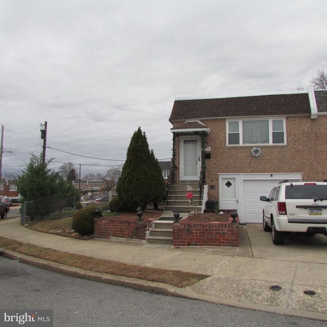 view of front of property with a garage