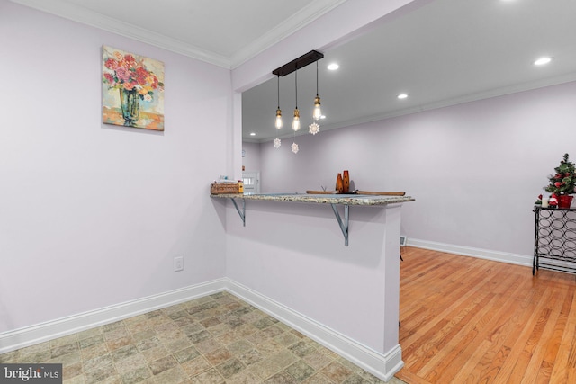 interior space featuring crown molding, light hardwood / wood-style flooring, and decorative light fixtures